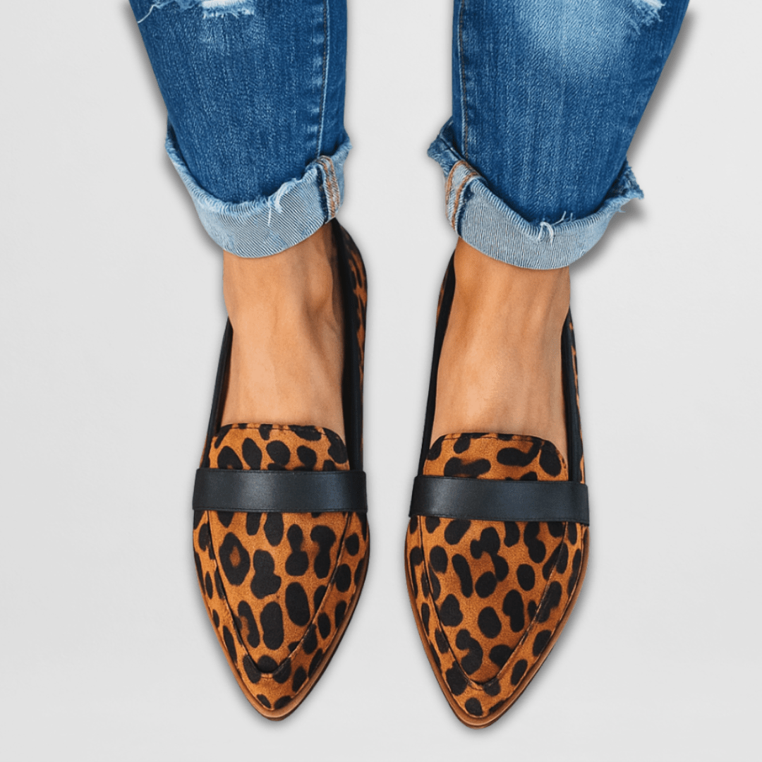 Leopard print suede loafers with black strap and pointed toe