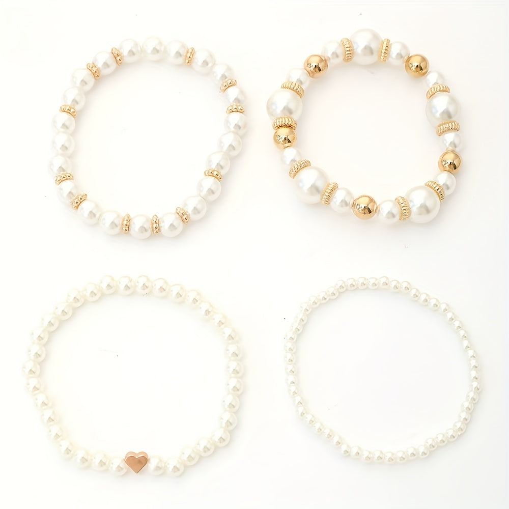 Pearl bracelet set with gold beads and small heart charms, four bracelets