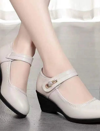 Light beige Mary Jane wedge heels with T-strap and decorative buckle