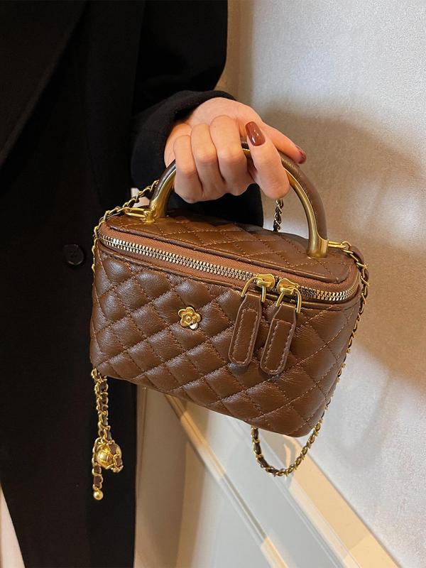 Brown quilted crossbody bag with gold-tone chain and top zip closure