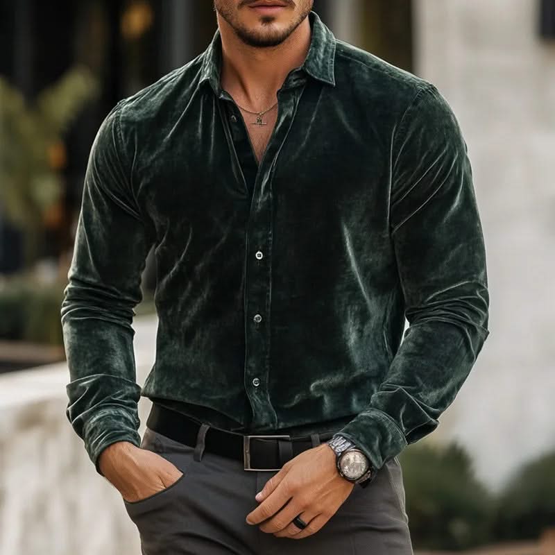 Green velvet button-up shirt with long sleeves and pointed collar.