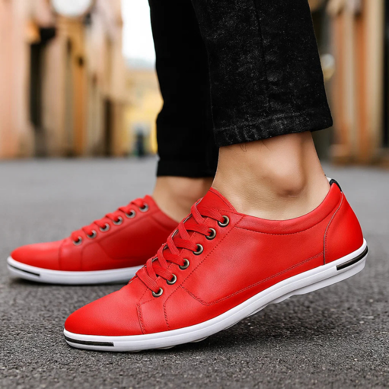 Red leather low-top sneaker with lace-up front and white rubber sole