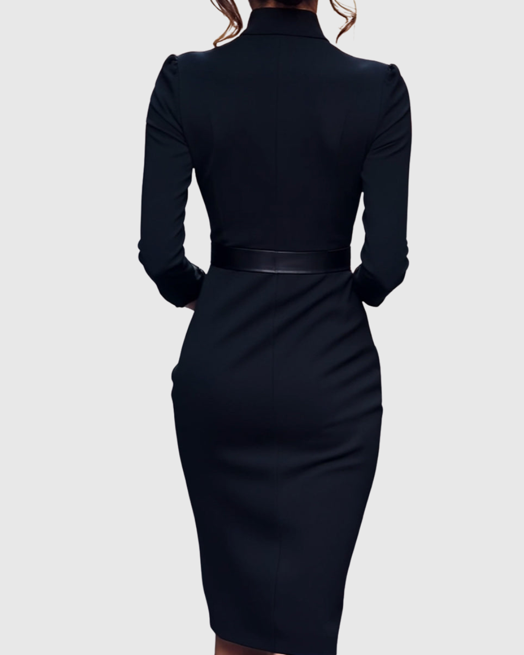 Back view of black fitted midi dress with long sleeves and waist belt with square buckle.