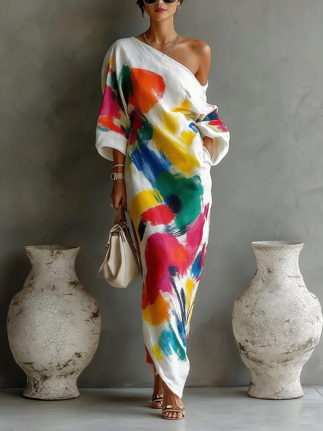 One-shoulder maxi dress in white with bold multicolor abstract paint pattern, draped sleeves