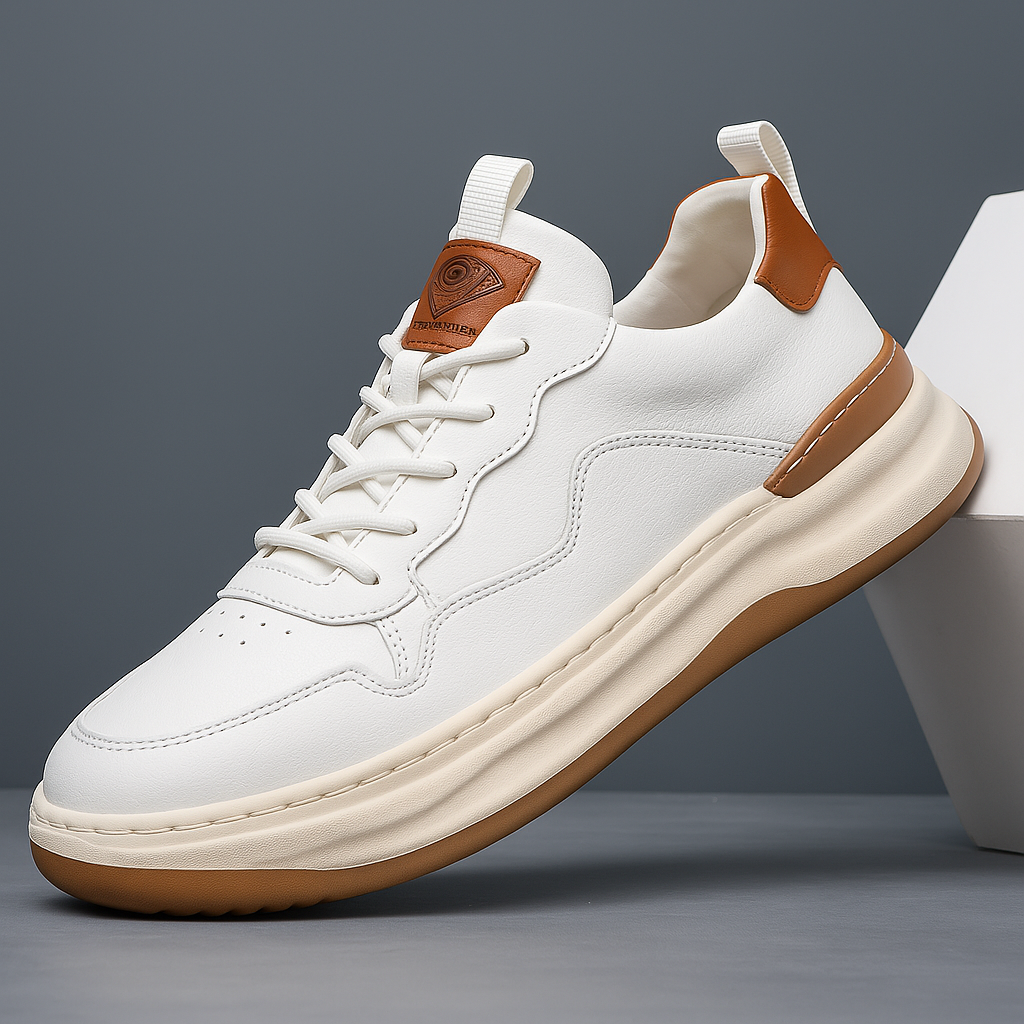 White leather low-top sneaker with lace-up front, orange-brown heel and cream sole
