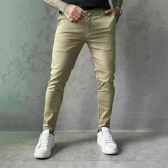 Khaki slim trousers with tapered legs, button waist, and side pockets