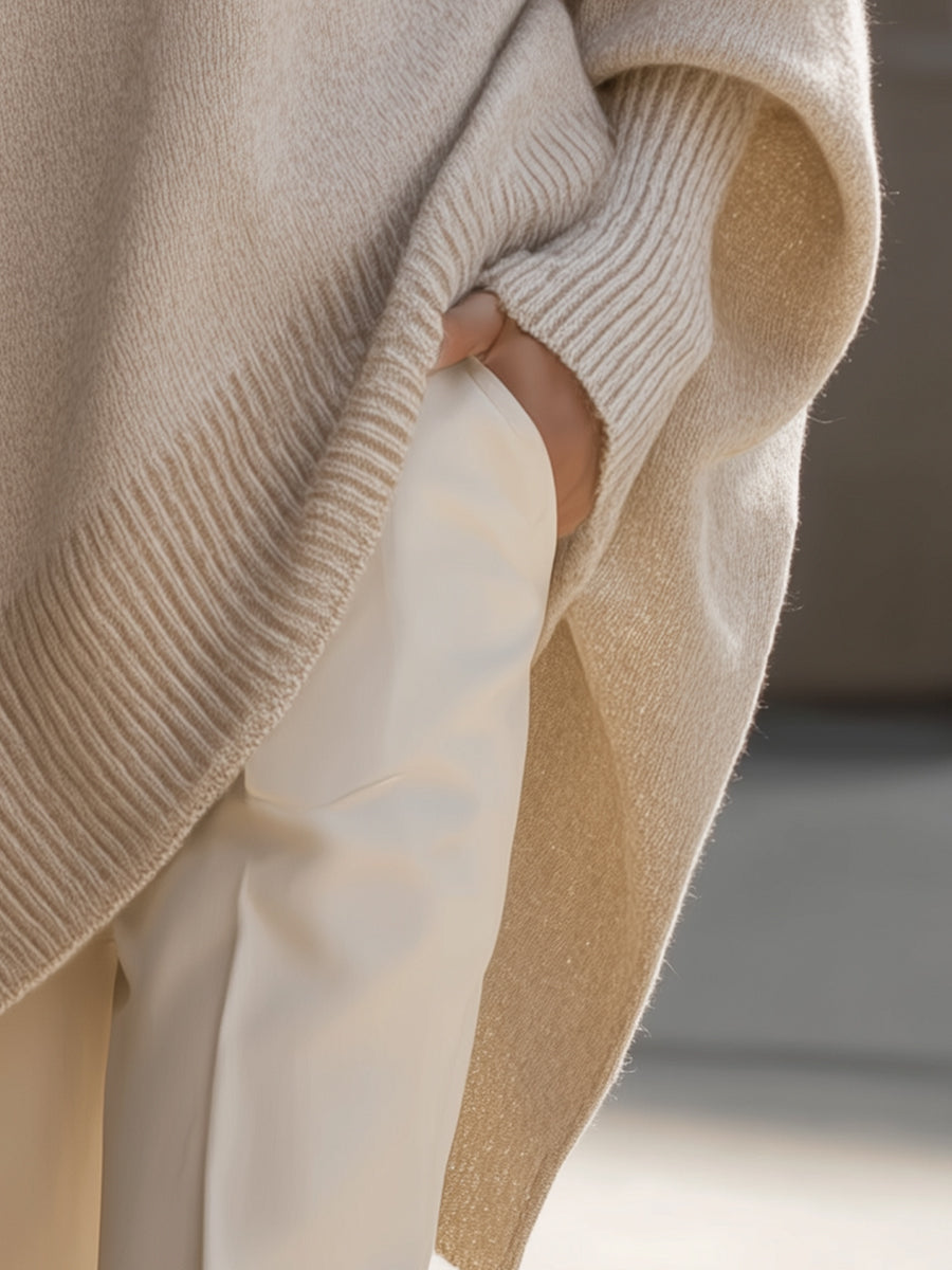 Pink drop-shoulder knit jumper with ribbed crew neck and draped asymmetric hem