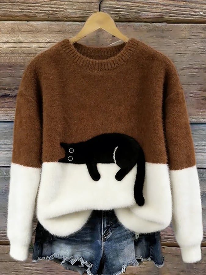 Brown oversized sweater with white hem and cuffs, featuring a black penguin front graphic.