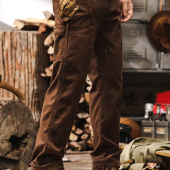 Brown straight-leg utility pants with front cargo pockets and belt loops