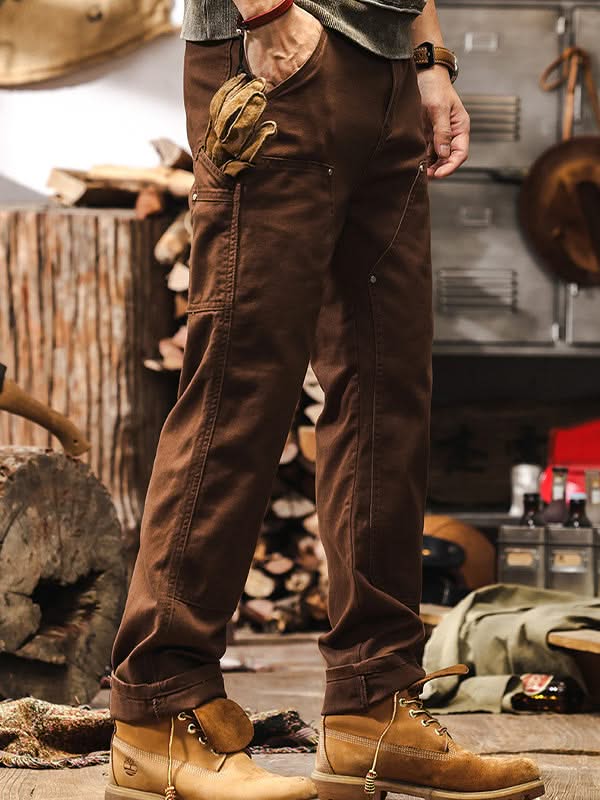 Brown straight-leg utility pants with front cargo pockets and belt loops