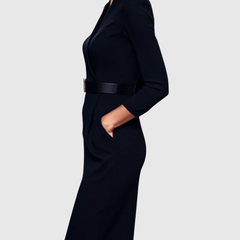 Black fitted midi dress with V-neck, long sleeves, and waist belt with square gold buckle.