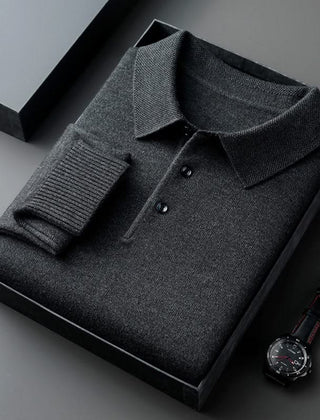 Dark grey long-sleeve knit polo shirt with button placket and fold-over collar.
