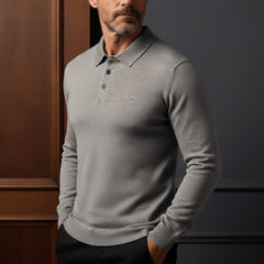 Light grey long-sleeve knit polo shirt on a man, featuring button placket and collar.