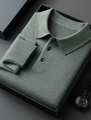 Green long-sleeve knit polo shirt with button placket and fold-over collar.