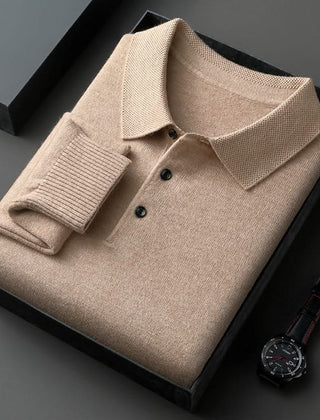 Beige long-sleeve knit polo shirt with button placket and fold-over collar.