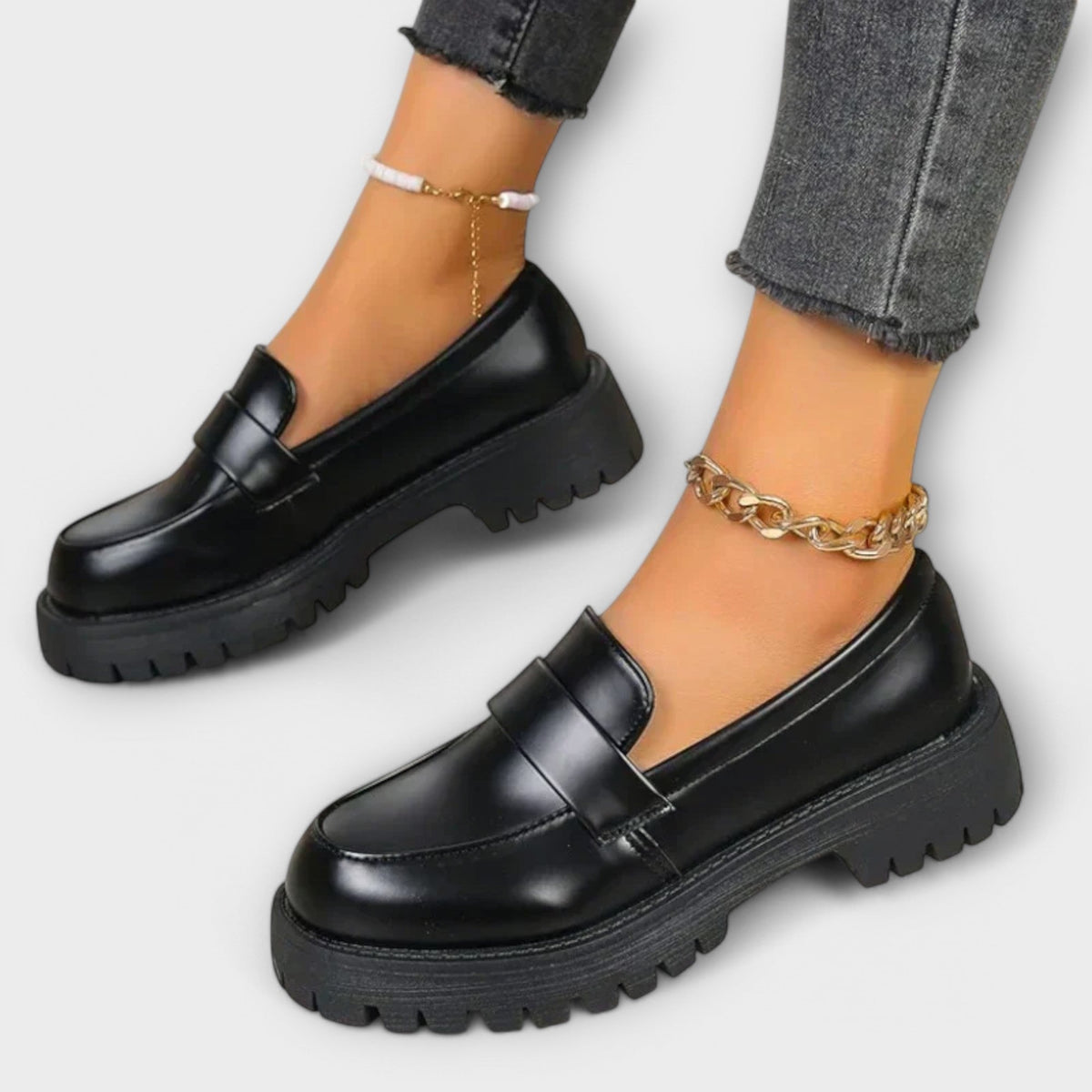 Zelvana black moccasin platform loafers with gold chain ankle strap