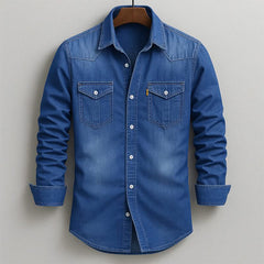 Blue denim button-up shirt with two chest flap pockets and long sleeves
