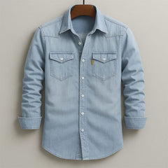 Light blue denim button-up shirt with two chest flap pockets and button front