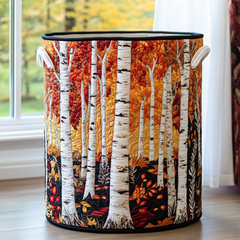 Quilted laundry basket with handles, vertical stripes, and autumn forest tree print