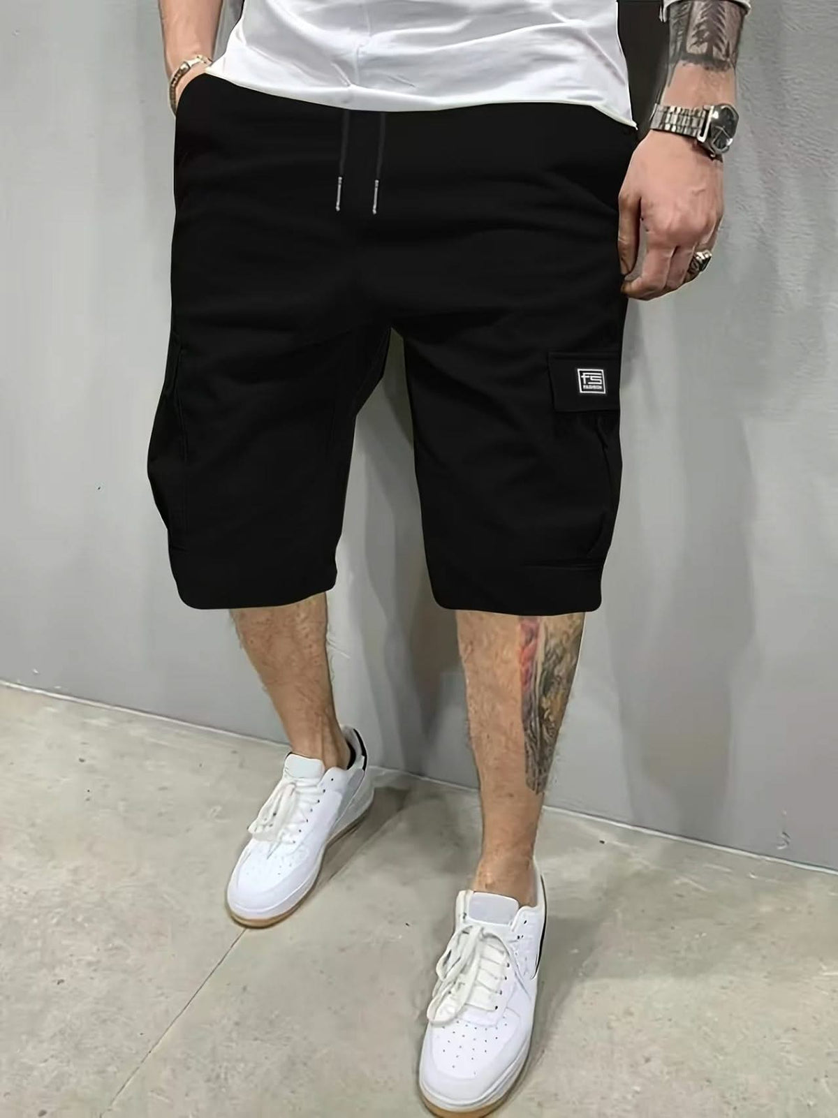 Black utility shorts with drawstring waist and side cargo pockets