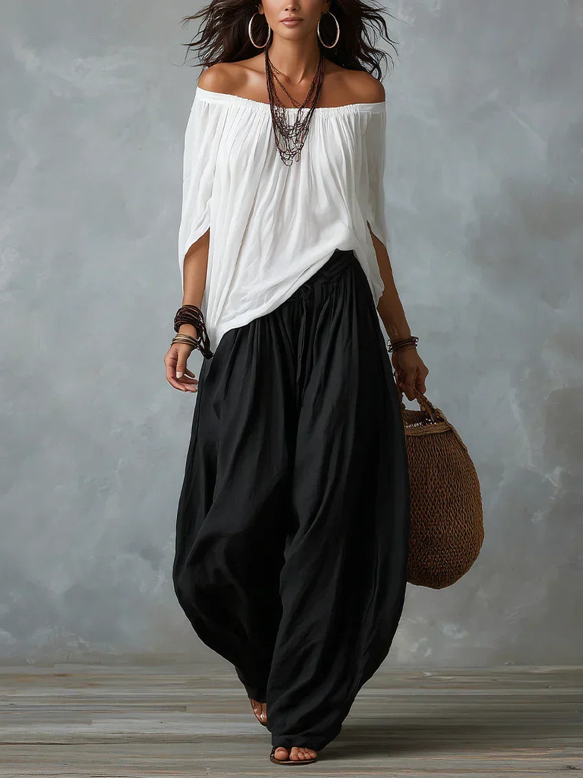 White off-shoulder top and black lantern trousers set