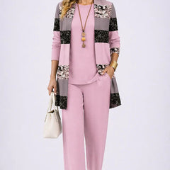 Soft pink 3-piece outfit with paneled floral jacket, matching blouse, and straight trousers