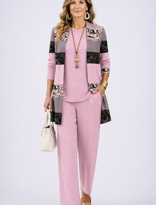 Soft pink 3-piece outfit with paneled floral jacket, matching blouse, and straight trousers