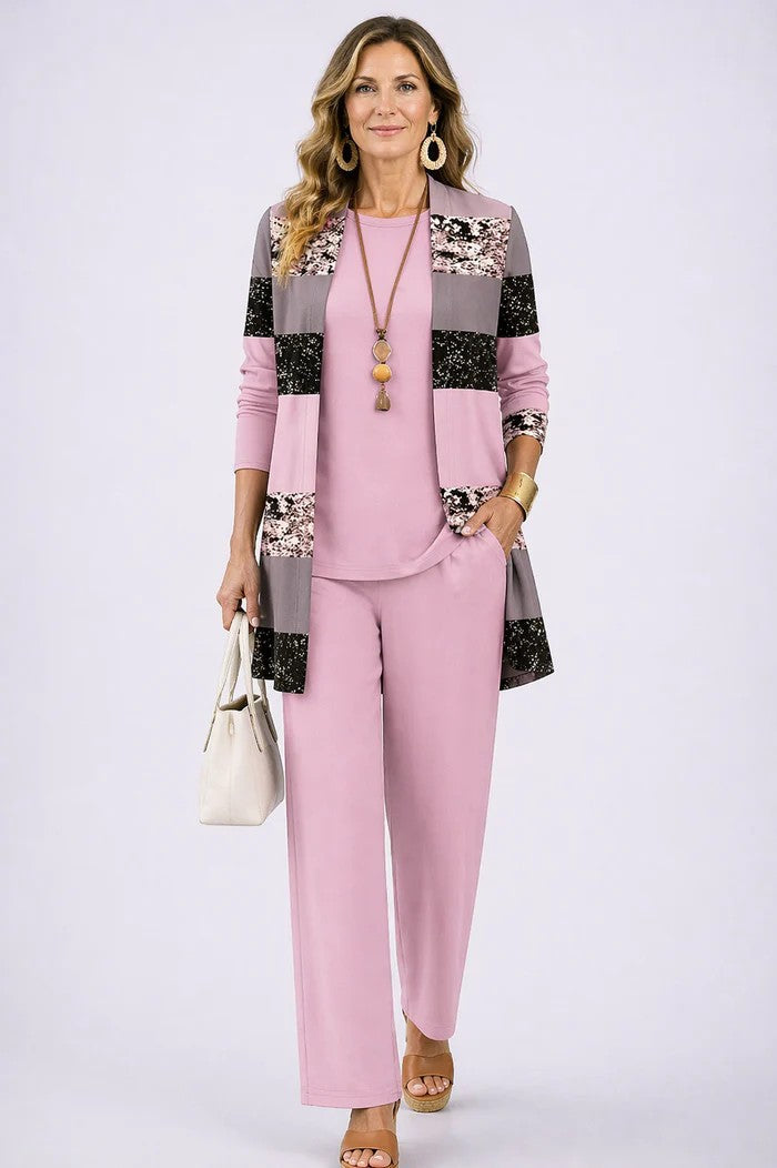 Soft pink 3-piece outfit with paneled floral jacket, matching blouse, and straight trousers