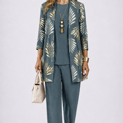 Women’s 3-piece set with teal top and pants, plus leaf-pattern open-front jacket.