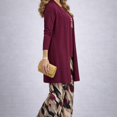 Women's maroon long cardigan over solid top with abstract print wide-leg trousers