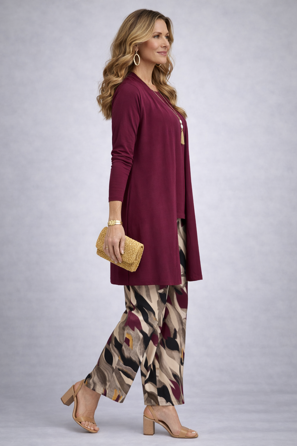 Women's maroon long cardigan over solid top with abstract print wide-leg trousers