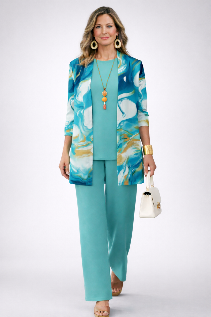 Women’s teal 3-piece set with blue abstract jacket and matching wide-leg trousers