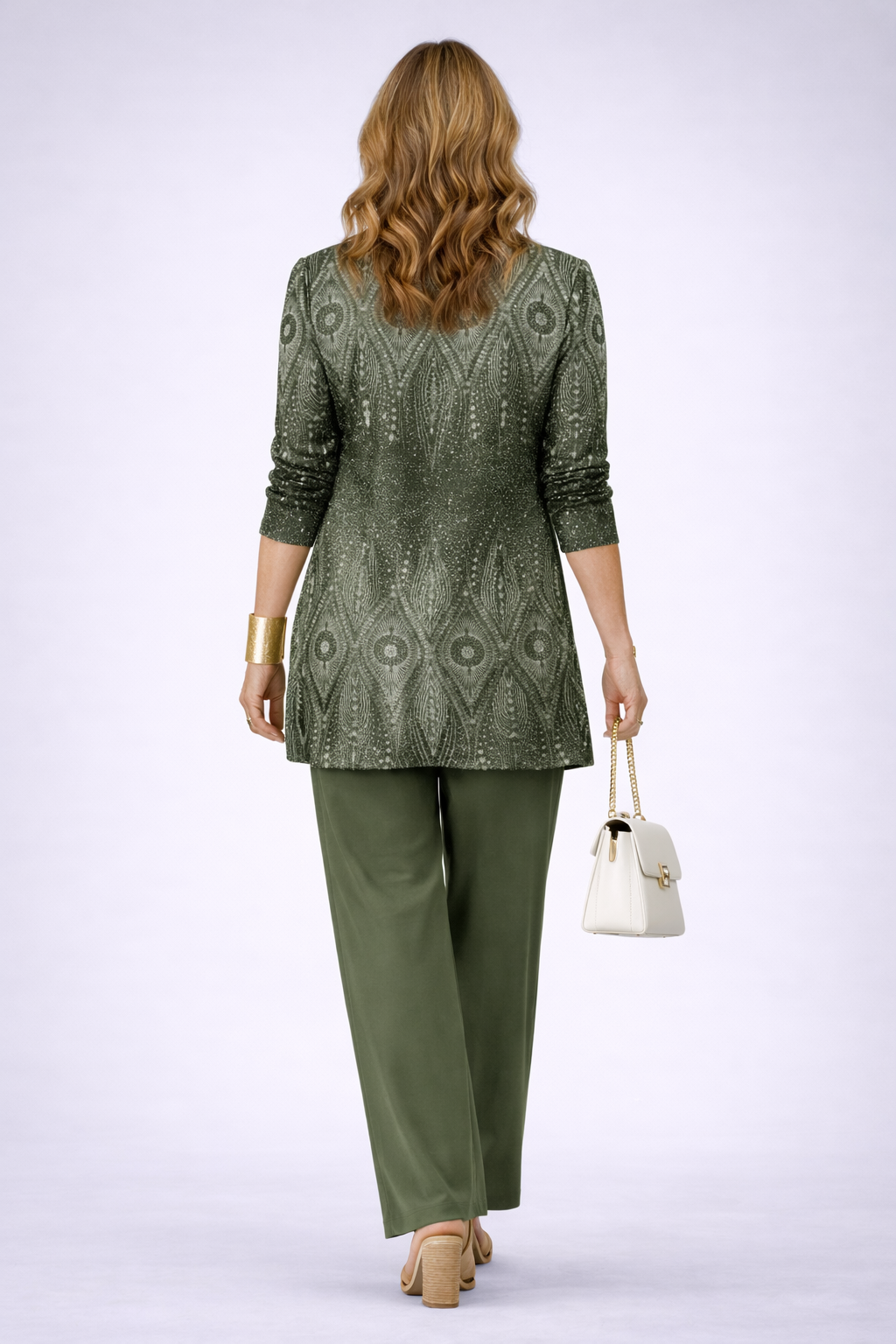 Green women's 3-piece set with patterned back jacket, matching pants, and small white handbag