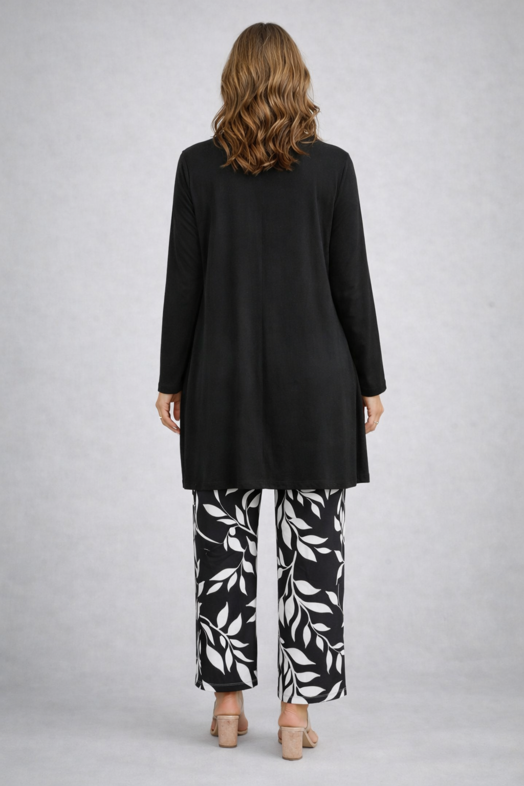 Black 3-piece set with long cardigan and leaf-print pants, back view