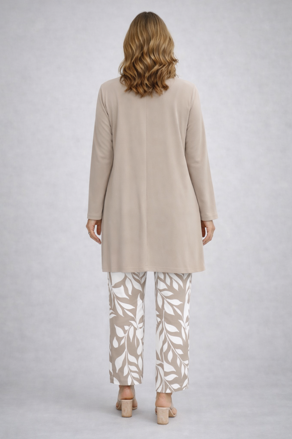 Beige long-sleeve tunic and leaf-print pants, back view