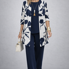 Women’s navy pants set with white floral open-front jacket and navy top