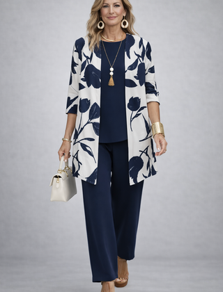 Women’s navy pants set with white floral open-front jacket and navy top