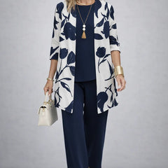 Navy 3-piece outfit with leaf-print open jacket, matching blouse, and straight trousers