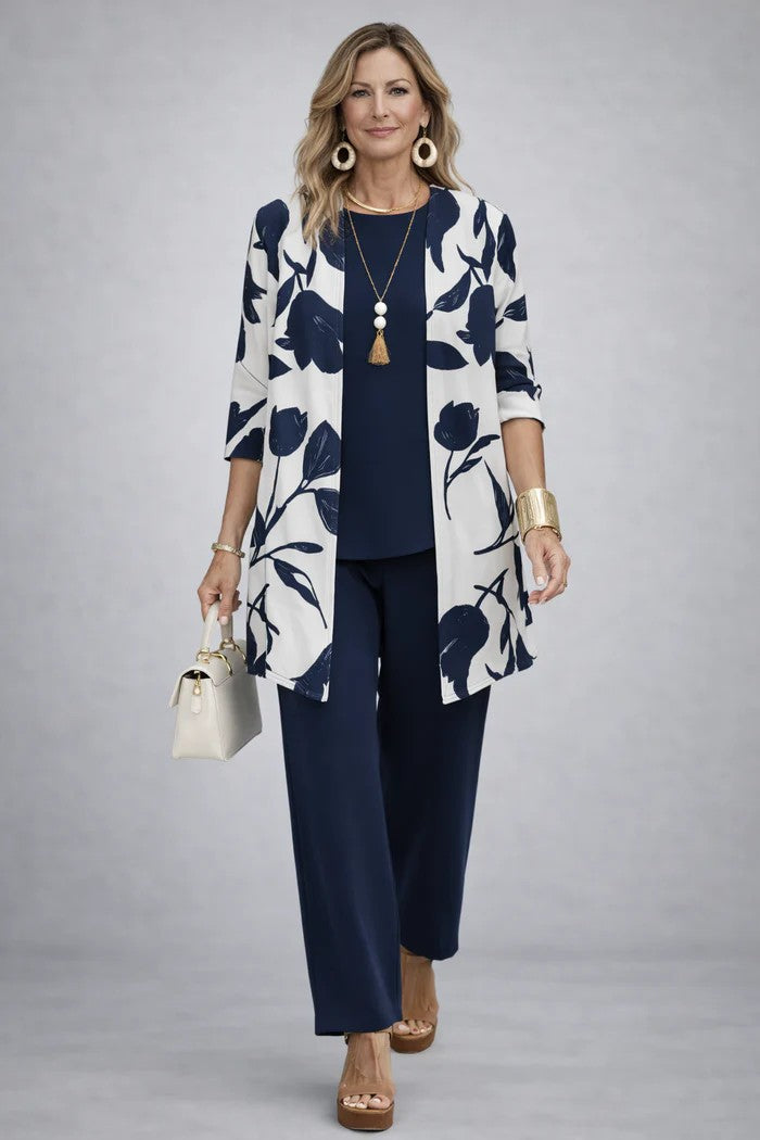 Navy 3-piece outfit with leaf-print open jacket, matching blouse, and straight trousers
