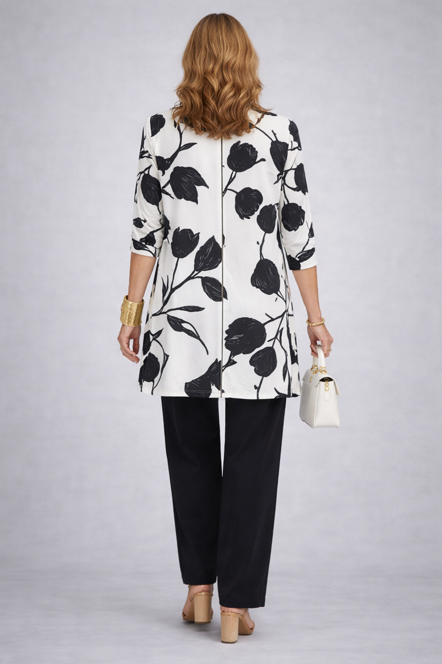 Etheline 3-piece set: back view of black-and-white floral open jacket over black trousers