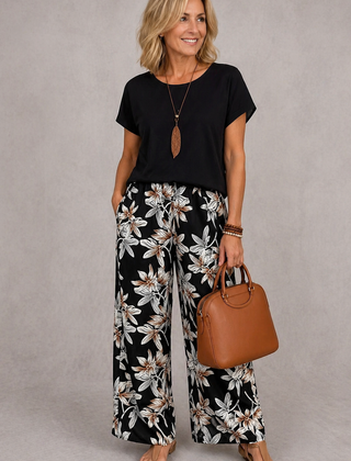 Black short-sleeve top and black floral wide-leg pants set