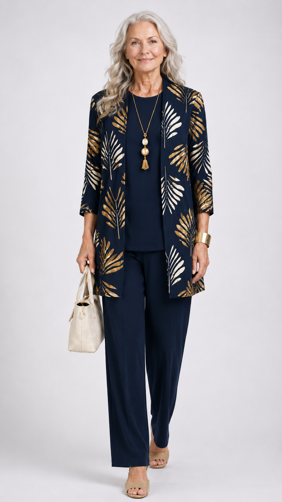 Women’s 3-piece set with navy top and pants, plus gold-and-ivory leaf open jacket.