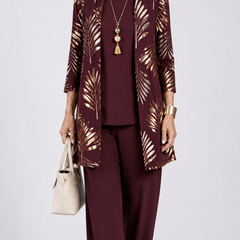 Women’s 3-piece set with dark plum top and pants, plus gold leaf open-front jacket.