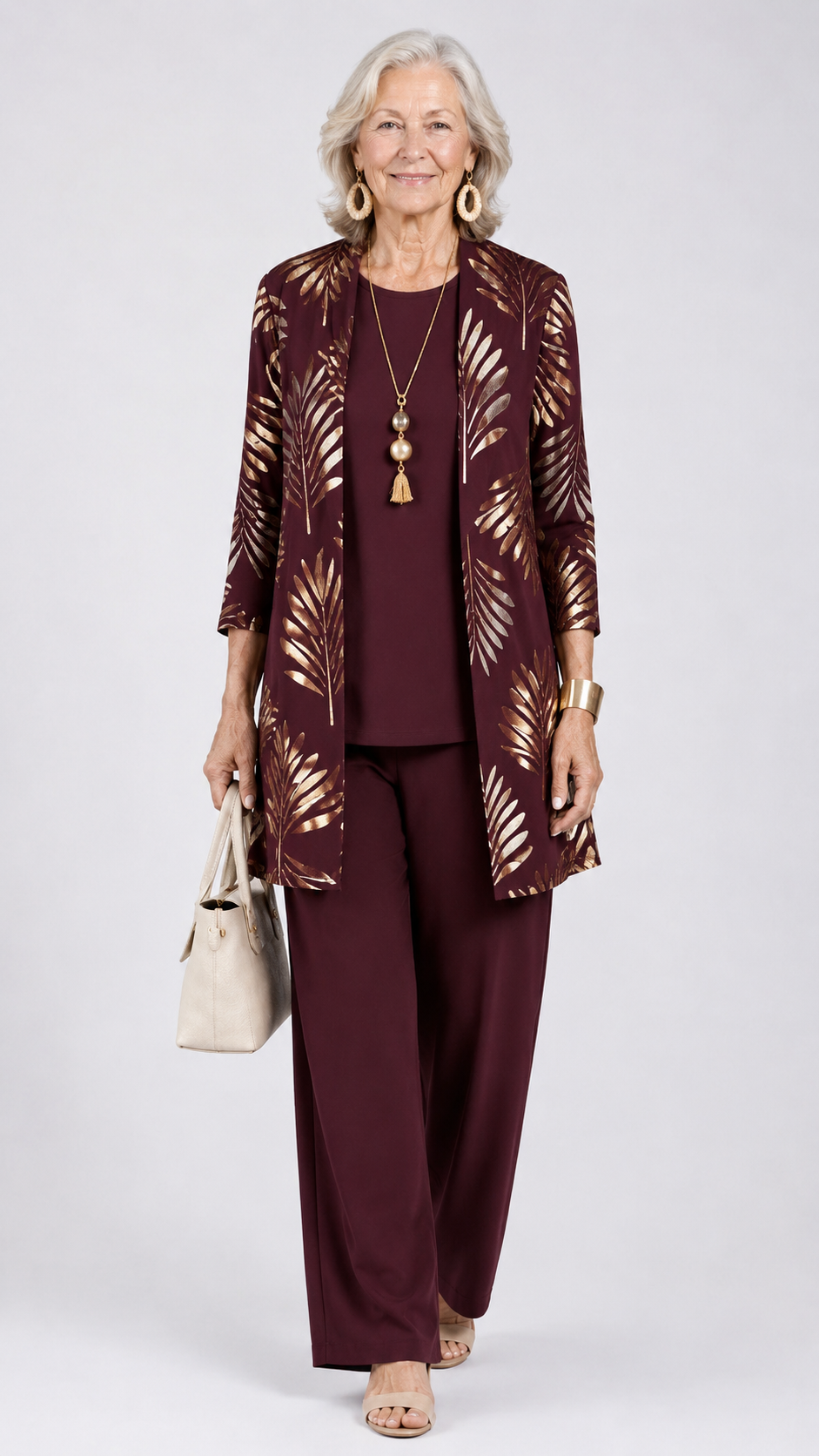 Women’s 3-piece set with dark plum top and pants, plus gold leaf open-front jacket.