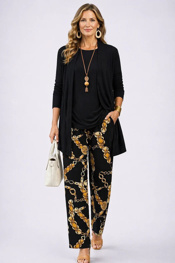 Black 3-piece set with open-front jacket, black top, and gold chain print pants