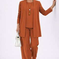 Rust elegant 3-piece set with open cardigan, shell top, and straight-leg pants.