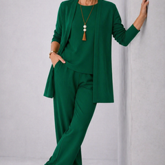 Green elegant 3-piece set with long cardigan, layered top, and tapered trousers.