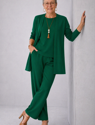 Green elegant 3-piece set with long cardigan, layered top, and tapered trousers.