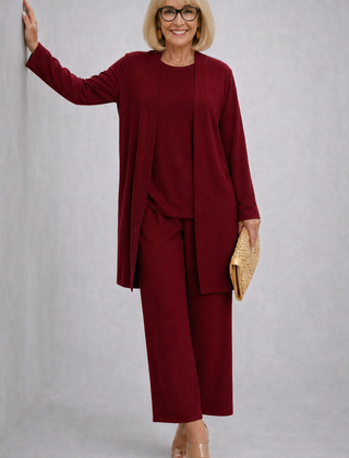 Burgundy elegant 3-piece set with long cardigan, layered top, and wide-leg pants.