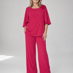 Red two-piece top and wide-leg pants set with ruffle shoulder detail